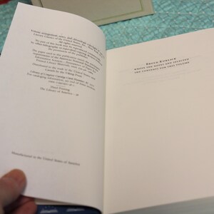 May include: An open hardcover book with white pages showing copyright and publication information on the left and the text 'Bruce Kuklick wrote the notes and selected the contents for this volume' on the right. The book has a dark blue endpaper.