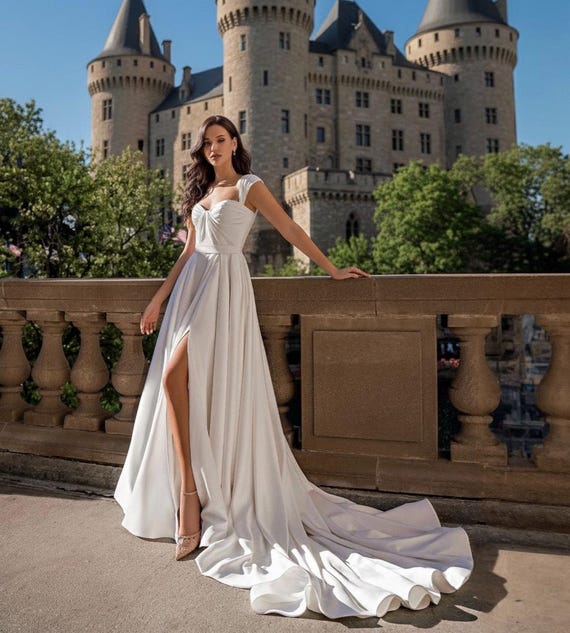 etsy a line wedding dress slit, Elegant Satin Wedding Dress with Slit, Open Back Bridal Gown, Minimalist A-Line Wedding Dress, Modern Bride Dress Fabric:Crepe dress-style:tea dresses White Satin A-Line Midi The dress fastens at