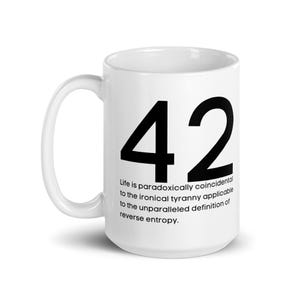 May include: White ceramic mug with a black number 42 printed on the front. The mug has a black text quote that reads "Life is paradoxically coincidental to the ironical tyranny applicable to the unparalleled definition of reverse entropy."