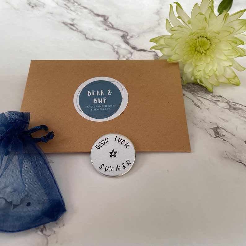 good luck aluminium pocket token with the name Summer and a star stamped on it.