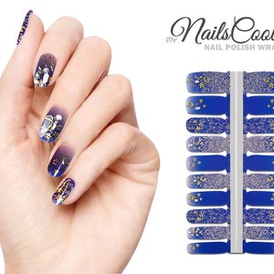 May include: Nail polish wraps with a blue and silver glitter background and gold crescent moons, stars, and swirls. The wraps are labeled "my Nails Cool Nail Polish Wraps".