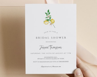 May include: A white card with a lemon illustration and text that reads "Join us for a Bridal Shower honoring Jessica Thompson. Saturday, the fifth of August at 3 PM. Edgewater Hall, 691 Bay St, Staten Island NY 10304. RSVP to Madison by July 15th at 000.000.0000. Registered at Amazon.com"