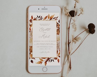 May include: A digital wedding invitation with a gold frame and autumn leaves. The invitation reads "You are invited to the wedding of Elizabeth and Michael, Saturday, the fifth of August, two thousand twenty two, at four o'clock in the afternoon, One Whitehall Place, London, SW1A 2HE."