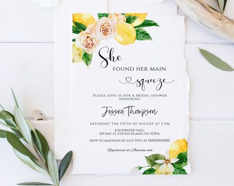 May include: A watercolor illustration of lemons and roses on a white background with text that reads "She Found Her Main Squeeze" and includes details for a bridal shower. The text also includes the bride's name, Jessica Thompson, the date and time of the shower, the location, and the RSVP information.
