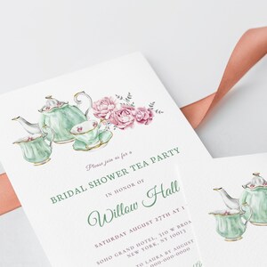 May include: A bridal shower tea party invitation with a watercolor illustration of a teapot and teacups with pink flowers. The invitation text reads "Please join us for a Bridal Shower Tea Party in honor of Willow Hall, Saturday August 27th at 1, Soho Grand Hotel, 310 W Broa, New York, NY 10013, RSVP to Laura by August, 000-000-0000".