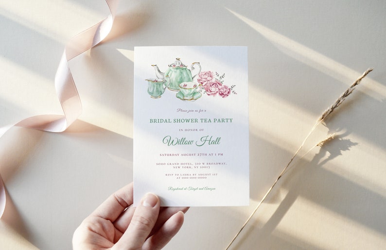 May include: A green and white teacup and teapot set with pink roses, a bridal shower tea party invitation for Willow Hall, Saturday August 27th at 1 PM at the Boro Grand Hotel, 310 Broadway, New York, NY 10013. RSVP to Laura by August 15th. Registered at Target and Amazon.