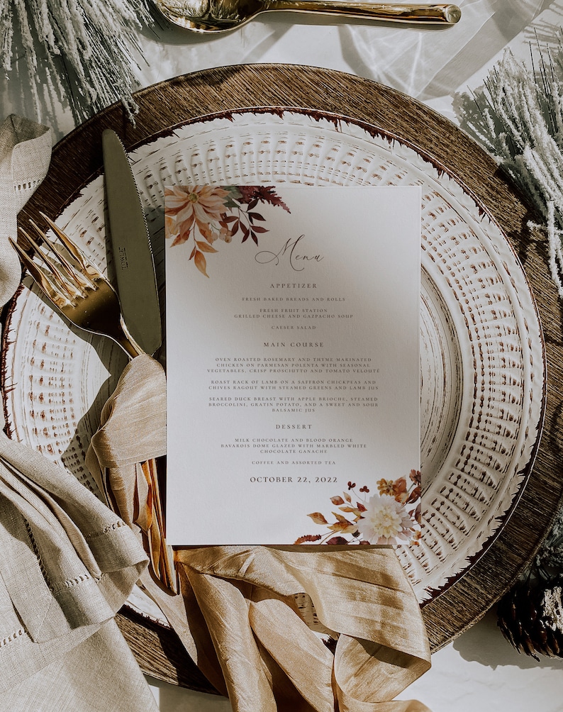 May include: A fall-themed menu with a watercolor illustration of autumn leaves and flowers. The menu lists appetizers, main courses, desserts, and coffee and tea. The date is October 22, 2022.