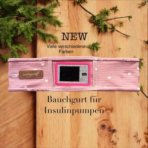 Cós elástico em malha para bombas de insulina, com janela de visualização, sem fecho - estilo pull-on, dois pequenos bolsos internos.