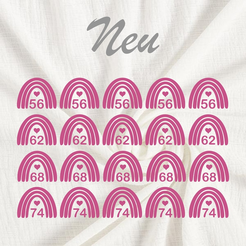 Pode incluir: Um conjunto de vinte patches de arco-&iacute;ris rosa para passar a ferro com um cora&ccedil;&atilde;o no centro. Os patches s&atilde;o numerados 56, 62, 68 e 74.
