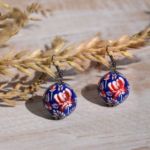 Ukrainian folk earrings Hand painted petrykivka inspired: Blue and red Wooden dangle pysanky jewelry