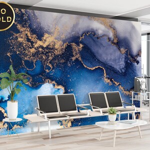 May include: A blue and gold abstract wall mural with a swirling, marbled pattern. The mural is displayed in a modern office setting with a coffee table and chairs.