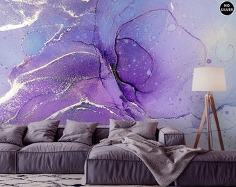 May include: Abstract purple and silver watercolor painting with a textured, marbled effect. The painting is displayed on a wall behind a purple sofa with a throw blanket.