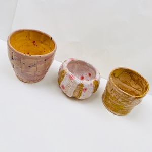 Trio of plant pots made by Inclusive Arts