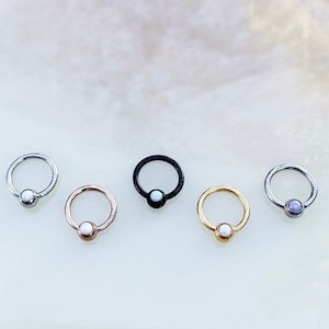 May include: Five different colored captive bead rings with a variety of colored beads. The rings are made of surgical steel and are available in a variety of sizes.