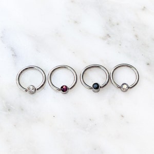 Captive Bead Crystal Hoop for Septum, Daith, and Cartilage piercings. 16 Gauge. 5/16”. Black, Purple, Clear, or Rainbow Crystal Jewelry