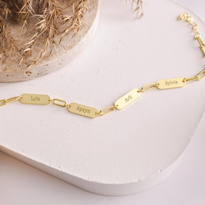 Custom Multiple Name Bracelet with mini bar design featuring kids names. Personalized bracelet for moms and grandmothers perfect as a family keepsake gift. Thoughtful jewelry for Mother’s Day and Christmas celebration. Elegant sterling silver bracelet with custom engraving makes a meaningful gift for her. Unique personalized jewelry that carries special names close to the heart. A timeless keepsake gift for family occasions birthdays anniversaries and holidays.