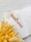 Personalized aluminum wire bookmark with handmade heart-shaped clasp, a lovely gift idea for Grandparents' Day. product logo