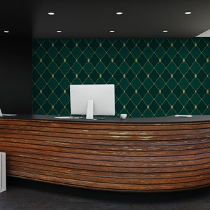 May include: A wooden reception desk with a curved front and a dark wood finish. The desk has a black countertop and two computers on it. The wall behind the desk is covered in a green and gold wallpaper with a geometric pattern.