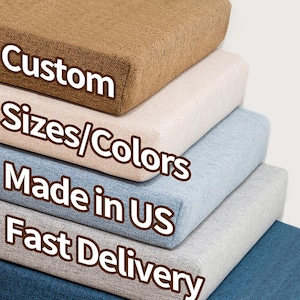 May include: Stack of five different colored fabric cushions with the text "Custom Sizes/Colors Made in US Fast Delivery" printed on the front.