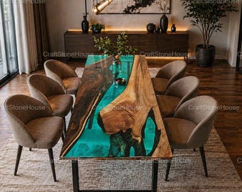 May include: A modern dining table with a live edge wooden top and a vibrant turquoise resin inlay. The table is supported by a black metal frame and surrounded by six upholstered chairs. The room features a neutral color palette.