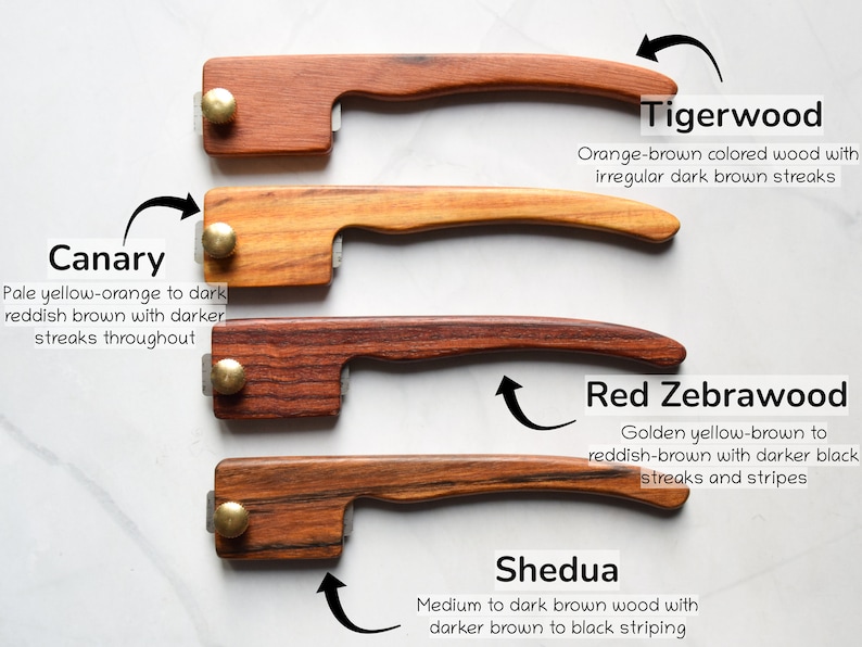May include: Four wooden handles with different wood grain patterns and colors. The handles are labeled with the names of the wood types: Canary, Tigerwood, Red Zebrawood, and Shedua. Each wood type is described with its color and grain characteristics.