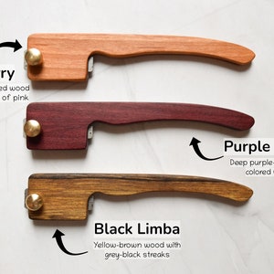 May include: Three wooden handles with brass accents. The handles are made of cherry, purple heart, and black limba wood.