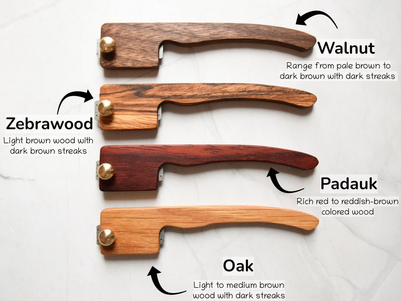 May include: Four wooden handles with brass accents, each handle is a different wood type: walnut, zebrawood, padauk, and oak. The wood types are labeled with their names and descriptions.