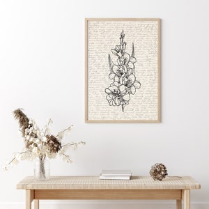 May include: A black and white line drawing of a flower with a vintage background. The drawing is framed and hanging on a white wall above a wooden bench.