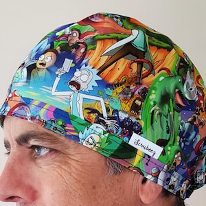 May include: A colorful scrub cap featuring a vibrant cartoon design with characters in a variety of poses. The cap has a tag that reads "Scrubeez". The background is a mix of orange, green, blue, and purple.