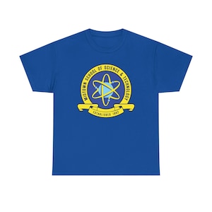 May include: A royal blue short-sleeve t-shirt featuring a circular yellow and blue emblem on the chest. The emblem displays an atom graphic with the text Midtown School of Science & Technology and the words Established 1982 on a yellow banner.