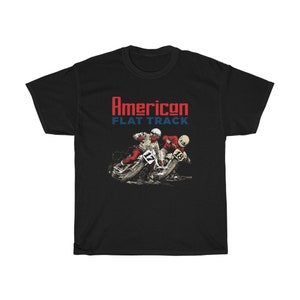 May include: Black t-shirt with a graphic of two motorcycle racers in red and white racing suits. The text "American Flat Track" is printed in red and blue.