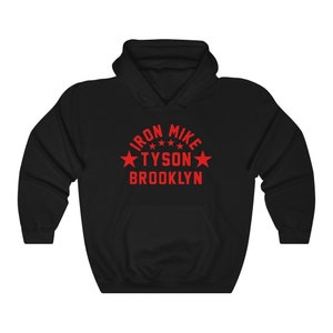 May include: Black hooded sweatshirt with a red graphic print that says "Iron Mike Tyson Brooklyn" with three stars above the name.