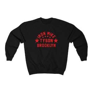 May include: Black sweatshirt with a red graphic that says "Iron Mike Tyson Brooklyn" with five red stars.