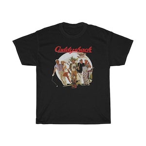 May include: Black t-shirt with a red "Caddyshack" logo and a vintage image of five men in a golf setting.