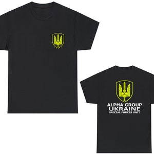 May include: Black t-shirt with a yellow trident logo on the left chest and the text "ALPHA GROUP UKRAINE SPECIAL FORCES UNIT" on the back.