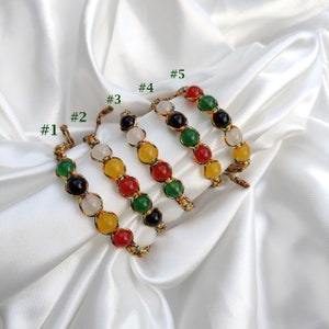 May include: A set of three ceramic mugs with a speckled, matte finish. The mugs are in shades of cream, light gray, and dark gray. Each mug has a simple, minimalist design, perfect for coffee or tea.