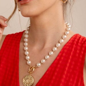 Engraved coin and pearl necklace