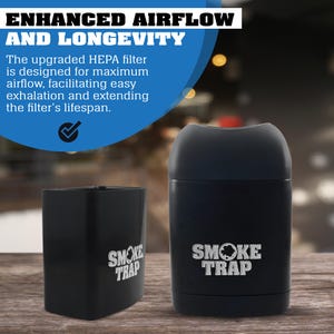 May include: Two black cylindrical containers with the text "SMOKE TRAP" printed in white on the front. The containers are made of a durable material and have a sleek design.
