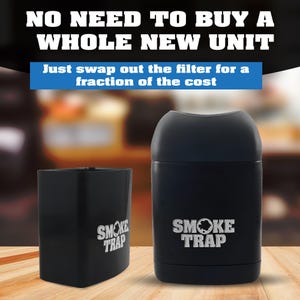 May include: Two black cylindrical containers with the text "SMOKE TRAP" printed in white on the front. The containers are on a wooden surface.