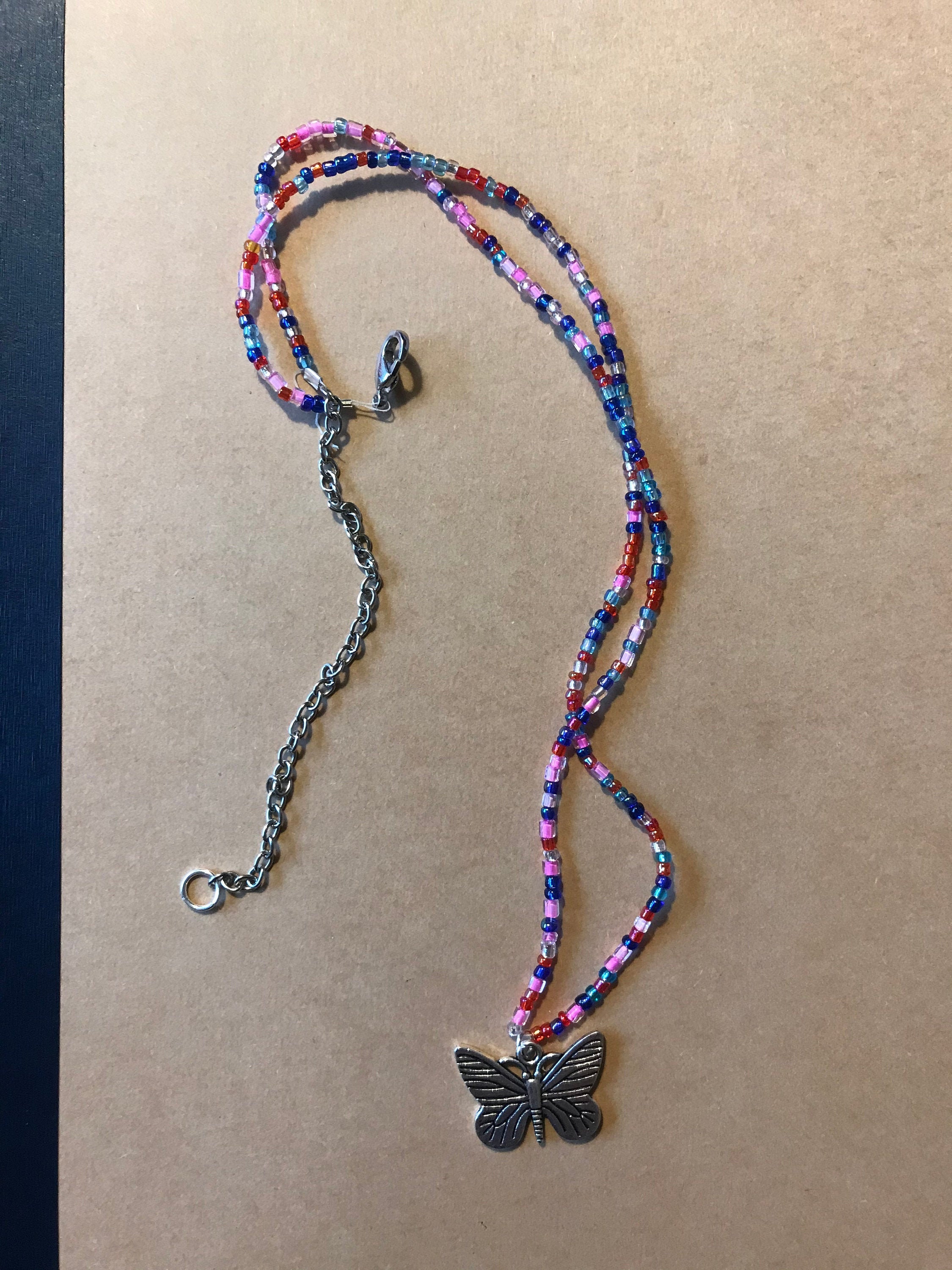 Beaded necklace with butterfly charm Etsy