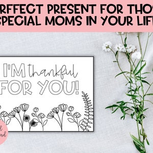 May include: A printable coloring page with the text "I'm thankful for you!" surrounded by a border of flowers and leaves. The text "digital download" is in the lower left corner.
