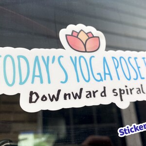Today's Yoga Pose Is Downward Spiral sticker on a car window, funny yoga vinyl decal with lotus flower