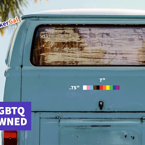 May include: A light blue vehicle with a sticker that reads "LGBTQ OWNED." The sticker features a rainbow-colored stripe and measures 7 inches long and .75 inches wide. The image also includes the text "StickerGal."