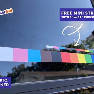 May include: A colorful sticker applied to a window, featuring a rainbow gradient and a smaller stripe above it. The text "FREE MINI STRIPE WITH 9" or 11" PURCHASE!" is visible. The sticker is labeled "LGBTQ OWNED".