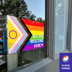 Waterproof Sticker | All Are Welcome Here IS Inclusive Outdoor Pride Window Decal - Premium Laminated Vinyl Sticker for your business window