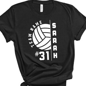 May include: Black t-shirt with a white volleyball graphic, the text "TEAM NAME" and "SARAH", and the number "#31".