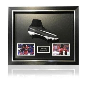 May include: A framed display featuring a black and white football boot, two photos of a footballer, and the text "Sadio Mané Liverpool F.C."