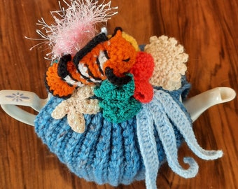 Calentador de teteras con forma de mar, con pulpo o arrecife de coral.