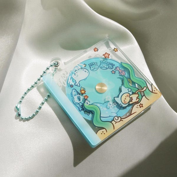 ocean frens cat spinnable cd crylic keychain