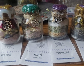 May include: Four small glass bottles with cork stoppers and gold pentagram charms. Each bottle is filled with various herbs, crystals, and other ingredients. The bottles are labeled with the following spells: Self Love, Focus, Protection, and Banish Depression Anti Anxiety.
